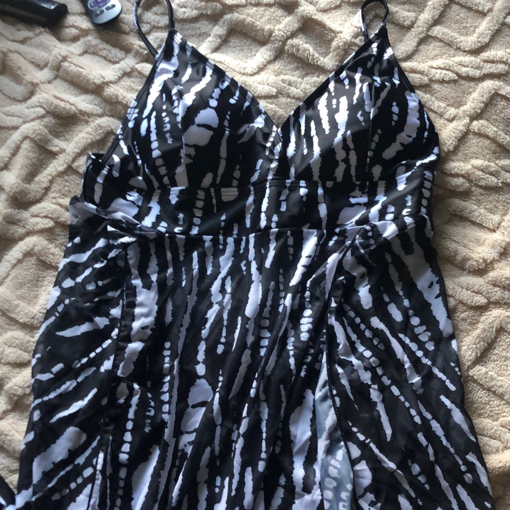 Two piece swim suit with sheer cover attached to top.👙